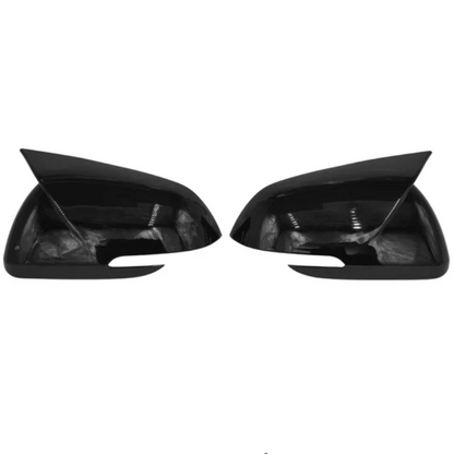 Batman style black mirror caps installed on Kia Sonet and Carens enhancing sporty look and providing protection to side mirror housing