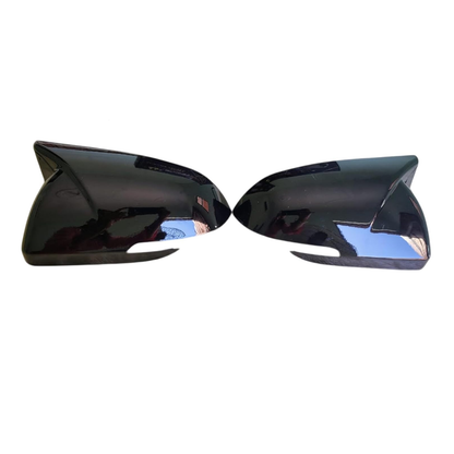 Batman style gloss black mirror covers set of 2 installed on Kia Seltos 2019-2023 adding sporty look and protecting side mirror housing